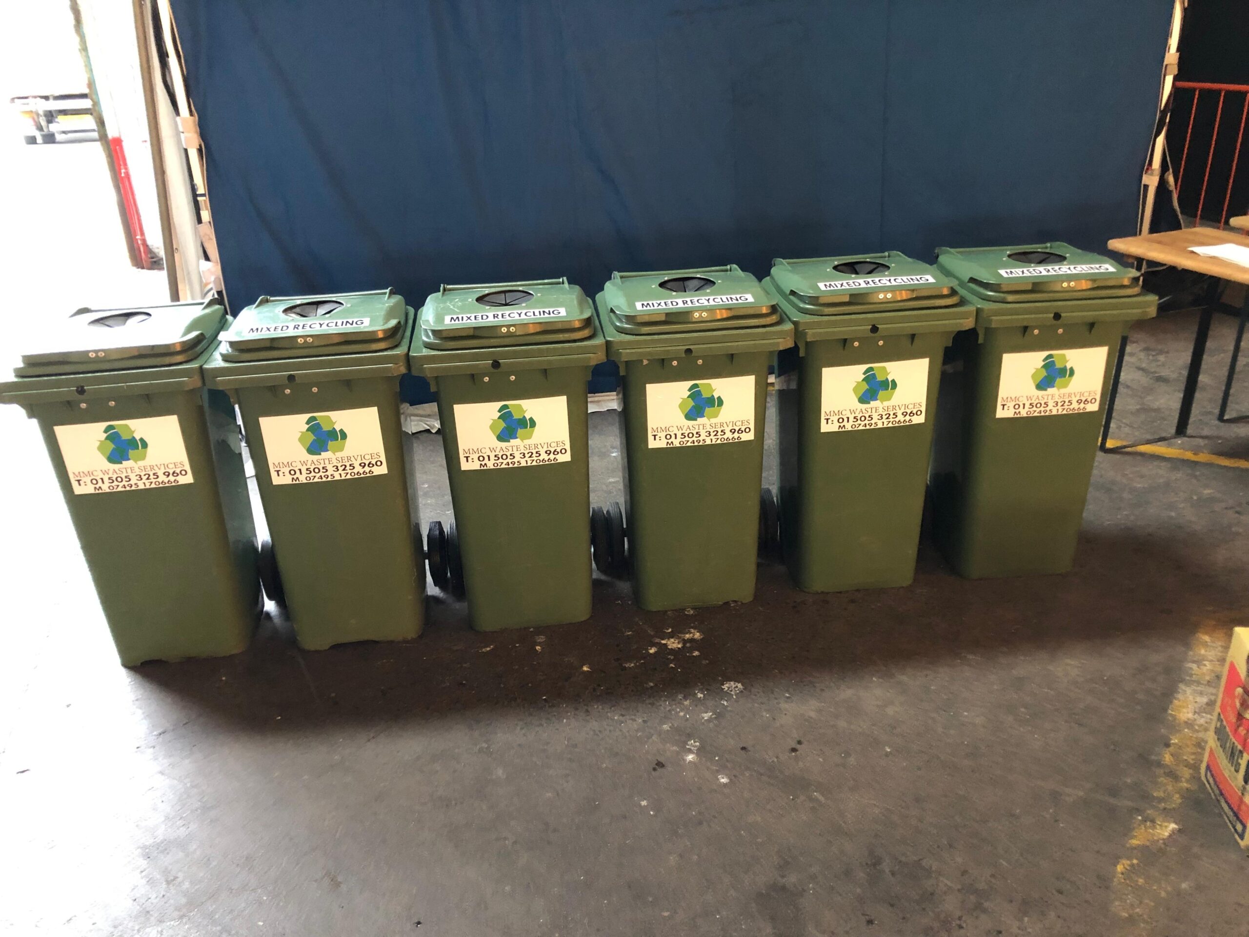 MMC branded green food waste bins lined up ready for collection